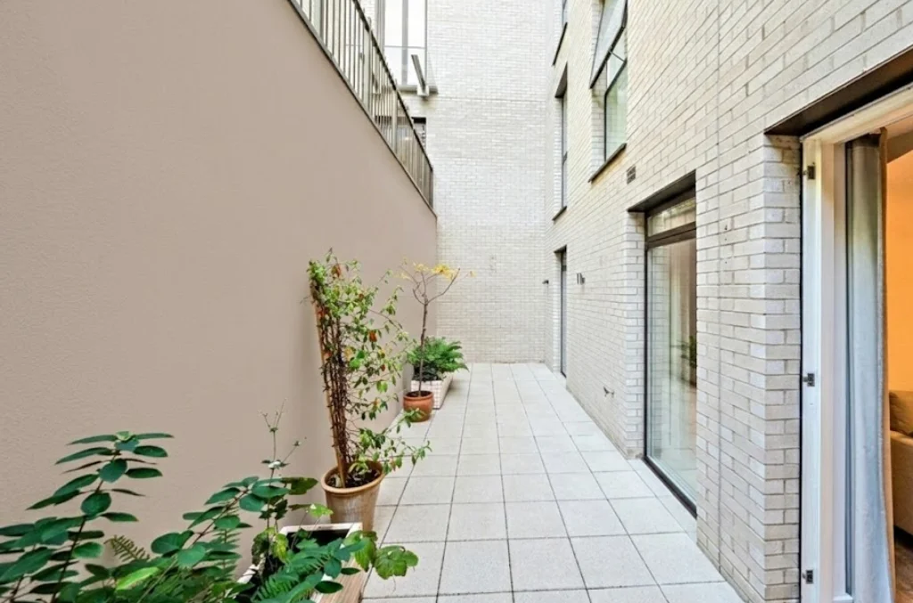 Private bedroom terrace with potted plants at The Avenue, Queen's Park NW6