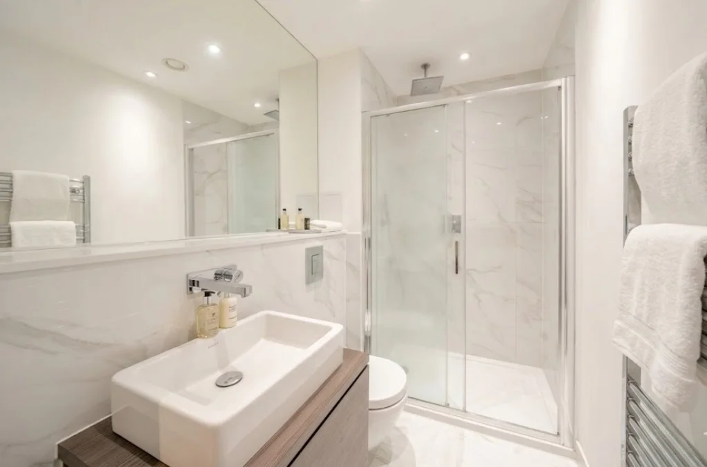 Shower room with rain shower head and heated towel rail at The Avenue, Queen's Park NW6